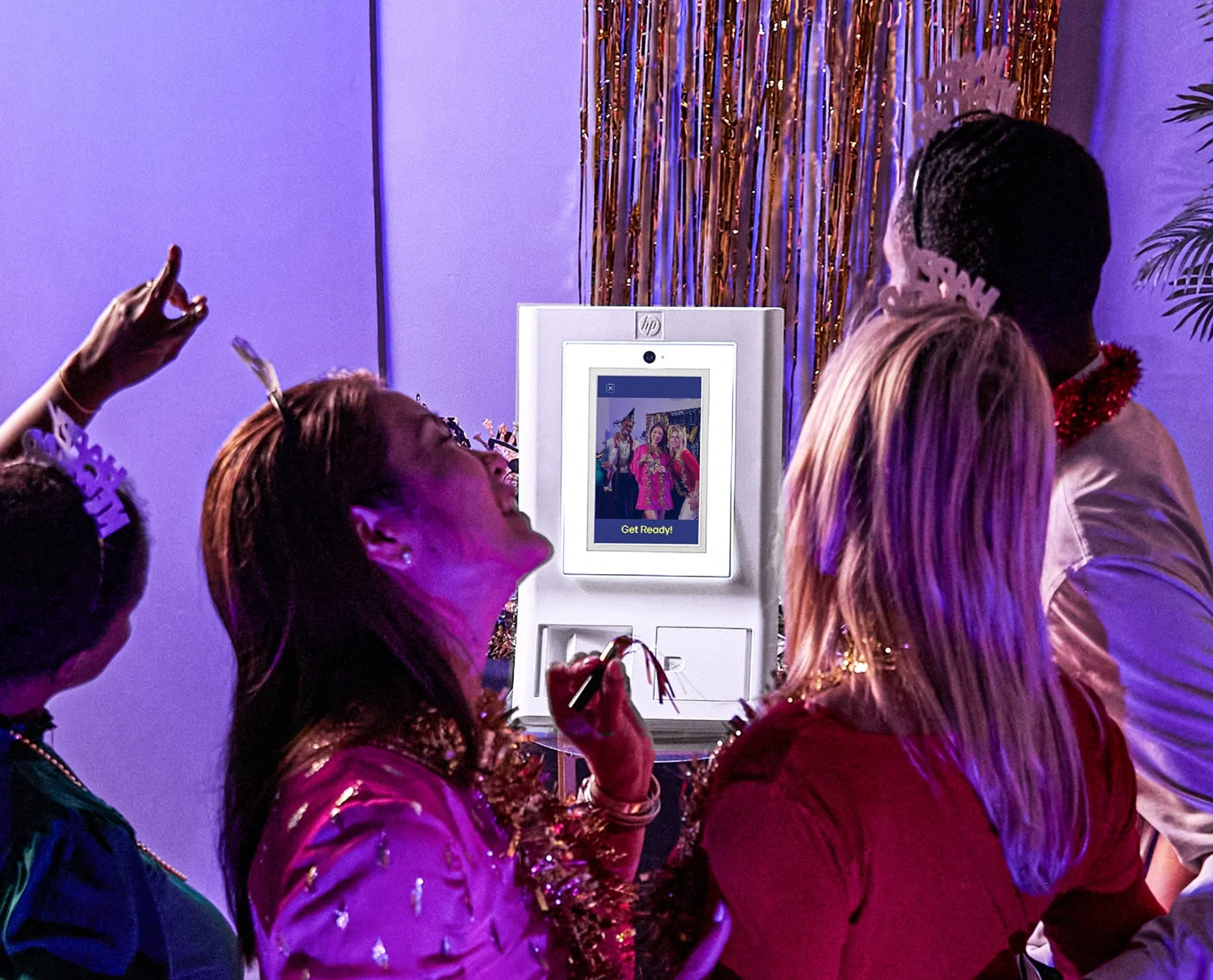 Guests enjoying the photo booth at a celebration
